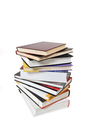High books stack isolated on white background. Many colorful book covers.の写真素材