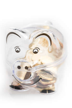 Piggy bank, coins and euro bills. Money saving concept. Banknotes closeup, isolated background.の写真素材
