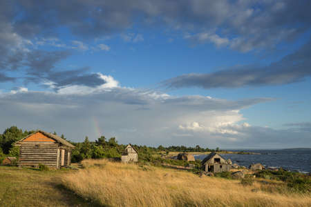 Abandoned houses in the Baltic Sea. Shore, nature and ruins facilities architecture concept. Mohni, small island in Estonia, Europe.の写真素材