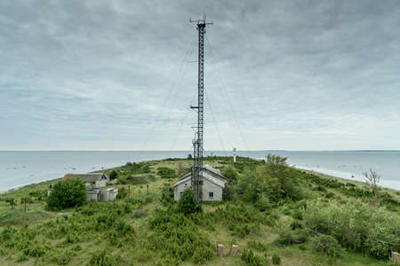 Abandoned houses in the Baltic Sea. Shore, nature and military ruins facilities architecture concept. Harilaid, small island in Estonia, Europe.の写真素材
