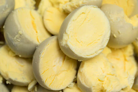 Sliced boiled egg yolk. Concept of food and organic farm products.の写真素材