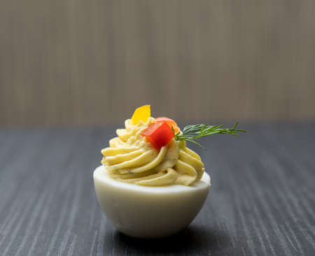 Sliced and filled boiled egg. Concept of food and organic farm products.の写真素材