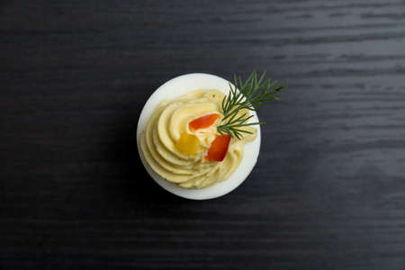 Sliced and filled boiled egg. Concept of food and organic farm products.の写真素材