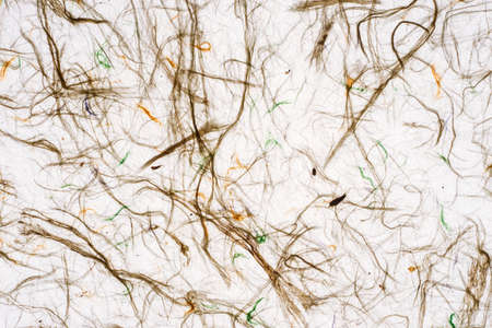 White self made paper sheet texture background. Multicolored embossed yarns, twine, lace pattern.の写真素材
