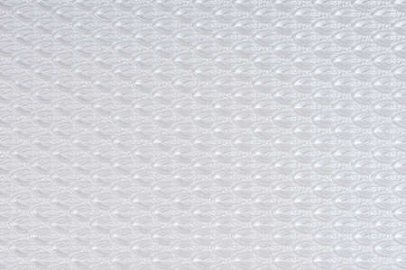 White self made paper pressed sheet texture background. Embossed lace pattern.