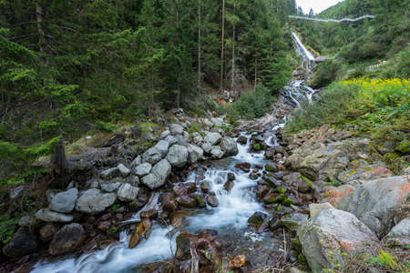 Mountain river and trees landscape. Kaunertaler Gletscher natural environment. Hiking in the alps, Kaunertal, Tirol, Austria, Europe.の写真素材