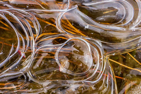 River landscape. Flowing water and ice. Natural winter background patternの写真素材