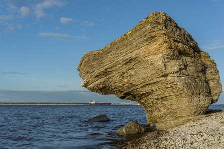 Stone wall on the Baltic sea in the summer. Pakri coast, island in Estonia, Europe.