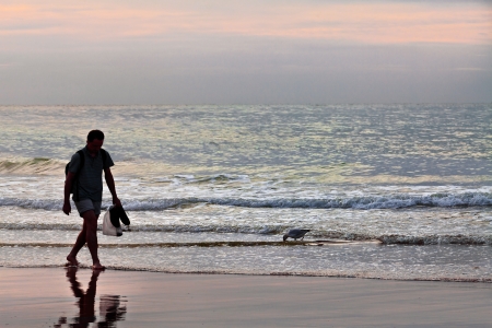 Young man on the beach. Seascape.の写真素材