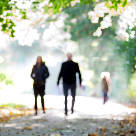 People in the autumn park. Blurred motion.の写真素材
