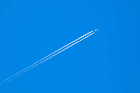 The plane in the blue sky. Flying plane.の写真素材
