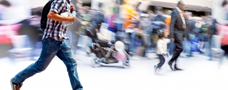 A large group of people walking. Blurred motionの写真素材