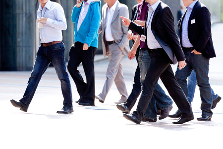 Businessmen walking on the street. Urban scene.の写真素材