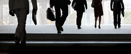 Businessmen walking on the street. Urban scene.の写真素材