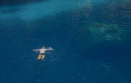 Snorkeler in Mediterranean turquoise water, Majorca, Spain  の写真素材