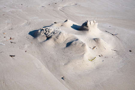 Sand castle leftover on a beach の写真素材