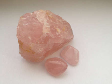 Pink rose quartz big raw and two small tumbled.の素材