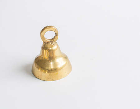 Single brass jingle bell 1 on white background の写真素材
