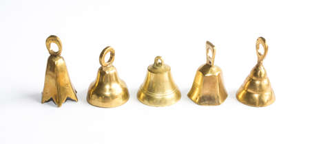 Five brass bells on white background 
