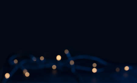 Midwinter blue with blurry light string for background and copy space の写真素材
