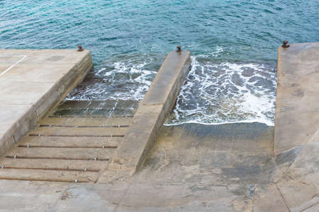 Two boat launch ramps seen from above の写真素材
