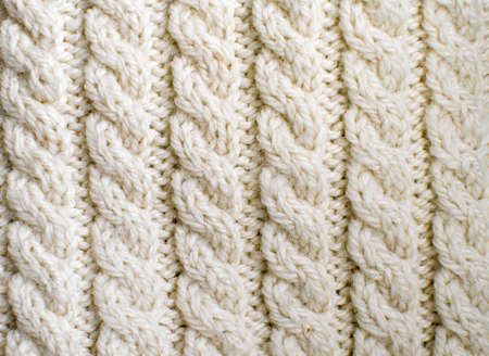 Creamy off-white wool knitwork  Creamy off-white wool knitwork full frame for warming artisan...