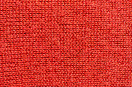 Red wool knitwork  Red wool knitwork full frame for warming backdrop or background 