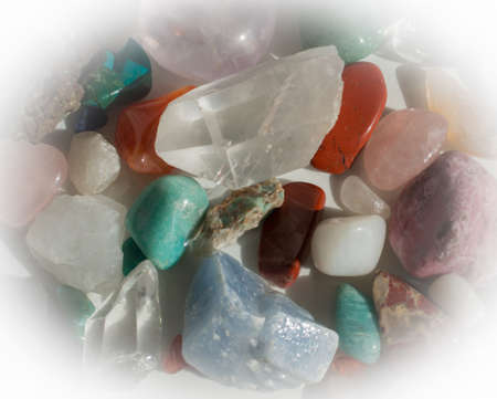 Heap of semi-precious stones - aventurine, quartz, calcite, turquoise, rhodochrosite, rose quartz...
