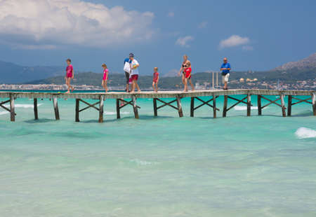 Playa de Muro jetty with emerald crystal clear water  Playa de Muro, Mallorca, Balearic islands, Spain のeditorial素材