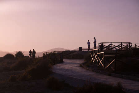 Evening walkers at Es Carnatge at summer sunset  Mallorca, Balearic islands, Spain  Soft lavender tone のeditorial素材