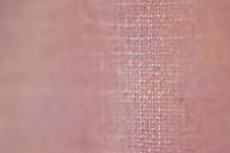 Canvas background in pale brown purplish red with line in selective focusの写真素材