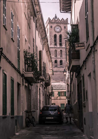 Street view with church tower in Pollensa, Mallorca, Balearic islands, Spain.のeditorial素材
