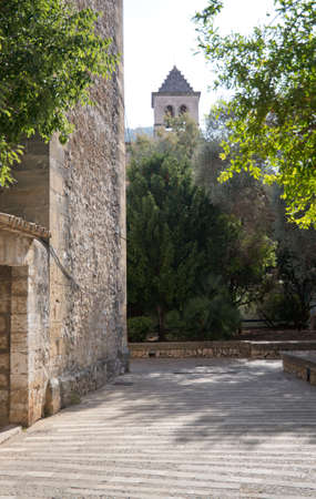 Empty Pollensa street with church tower. Mallorca, Balearic islands, Spain.の写真素材