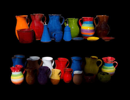 PORT DE SOLLER, MAJORCA, SPAIN - OCTOBER 25 2013: Balearic souvenirs. Vases, jugs and other decorative souvenirs from Mallorca isolated on black on October 25 2013, Port de Soller, Majorca Spain.のeditorial素材