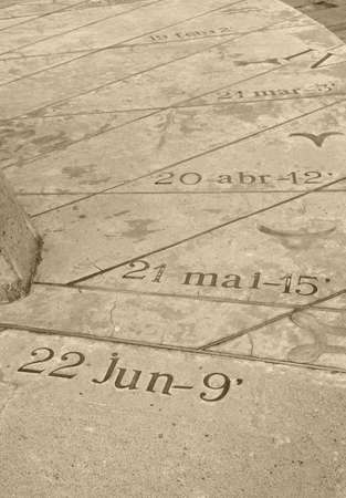 CAMP DE MAR, MAJORCA, SPAIN - OCTOBER 30 2013: Detail of the sundial sculpture with spring and summer calendar dates and sun angle over the horizon for June 22, May 21, April 20 etcetera, in Camp de Mar, Mallorca, Balearic islands, Spain in October. Artisのeditorial素材