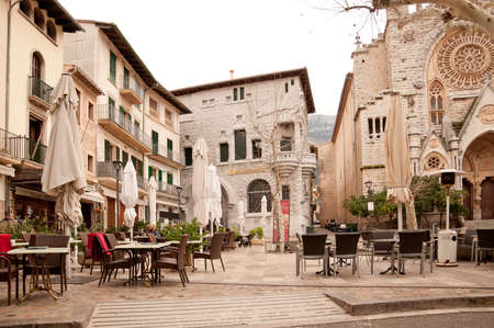 Soller square, Majorca, Spain - February 17 2013: The square in Soller is surrounded by historic architecture. Architect Rubio i Bellver, disciple of Gaudi, built the bank, nowadays the Santander bank office. Photo on February 17 2013 in Soller Majorca, Bのeditorial素材