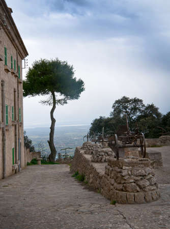 Santuari de Cura in Randa, Majorca, Spain - February 9 2013: Tree with a view towards the southeast and Cabrera island on February 9 2013 in Randa, Majorca, Balearic islands, Spainのeditorial素材