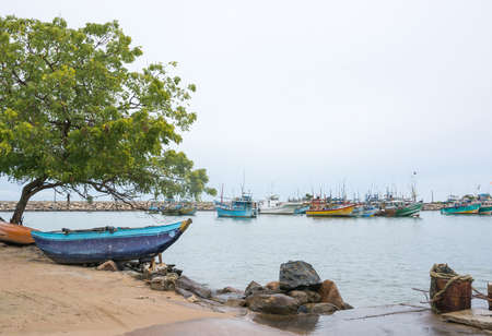 TANGALLE, SOUTHERN PROVINCE, SRI LANKA, ASIA - DECEMBER 20, 2014: Colorful wood fishing boats moored on December 20, 2014 in Tangalle port, Southern Province, Sri Lanka.のeditorial素材