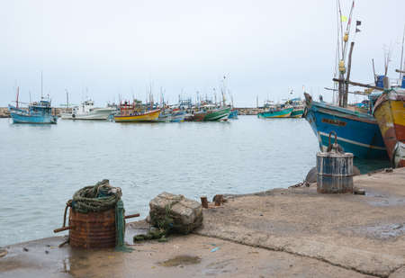 TANGALLE, SOUTHERN PROVINCE, SRI LANKA, ASIA - DECEMBER 20, 2014: Colorful wood fishing boats moored on December 20, 2014 in Tangalle port, Southern Province, Sri Lanka.のeditorial素材