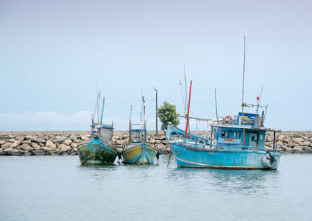 TANGALLE, SOUTHERN PROVINCE, SRI LANKA, ASIA - DECEMBER 20, 2014: Colorful wood fishing boats moored on December 20, 2014 in Tangalle port, Southern Province, Sri Lanka.のeditorial素材