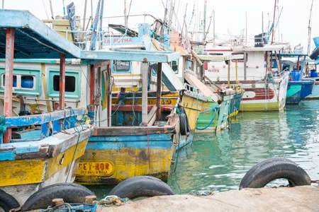 TANGALLE, SOUTHERN PROVINCE, SRI LANKA, ASIA - DECEMBER 20, 2014: Colorful wood fishing boats moored on December 20, 2014 in Tangalle port, Southern Province, Sri Lanka.のeditorial素材