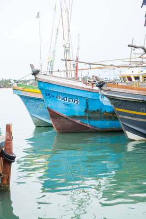 TANGALLE, SOUTHERN PROVINCE, SRI LANKA, ASIA - DECEMBER 20, 2014: Colorful wood fishing boats moored on December 20, 2014 in Tangalle port, Southern Province, Sri Lanka.のeditorial素材