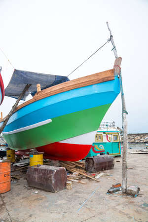 TANGALLE, SOUTHERN PROVINCE, SRI LANKA, ASIA - DECEMBER 20, 2014: Colorful wood fishing boats moored...