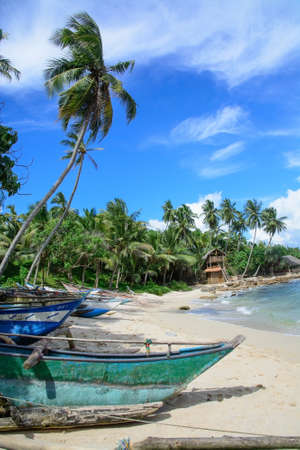 Sri Lankan boats on sandy beach in Tangalle, Southern Province, Sri Lanka, Asia.のeditorial素材