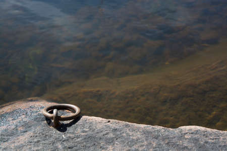 Mooring link by lake with transparent lake water.の写真素材