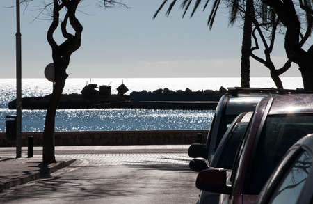 CALA ESTANCIA, MAJORCA, SPAIN - FEBRUARY 12, 2013: Cala Estancia street scene with ocean view in spring and sunny weather, waiting for the tourist season to set off in a month or two, on February 12 2013 in Cala Estancia, Majorca, Spain.のeditorial素材