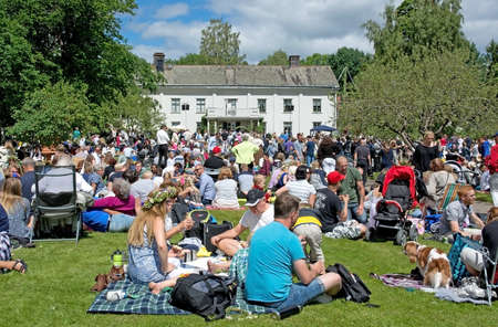 ALSTER, KARLSTAD, SWEDEN - JUNE 20, 2014: People at Midsummer celebrations and Norwegian - Swedish wedding on June 20, 2014 in Alster, Karlstad, Sweden.のeditorial素材