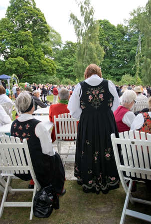 ALSTER, KARLSTAD, SWEDEN - JUNE 20, 2014: People at Midsummer celebrations and Norwegian - Swedish wedding on June 20, 2014 in Alster, Karlstad, Sweden.のeditorial素材