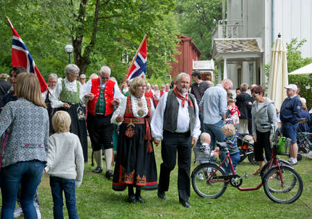 ALSTER, KARLSTAD, SWEDEN - JUNE 20, 2014: People at Midsummer celebrations and Norwegian - Swedish wedding on June 20, 2014 in Alster, Karlstad, Sweden.のeditorial素材