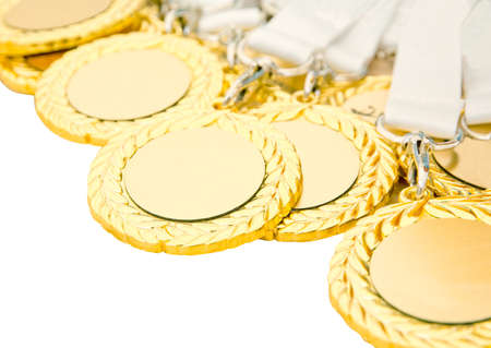 Gold medals with copy space isolated on white.の写真素材